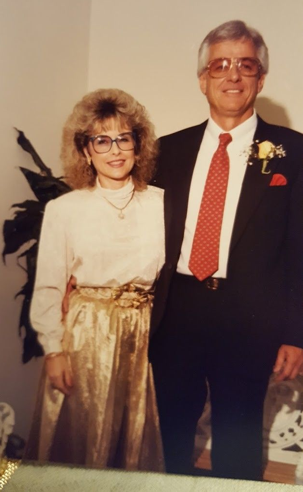 Spider on wooden plank. Gray body, black legs. Close-up.