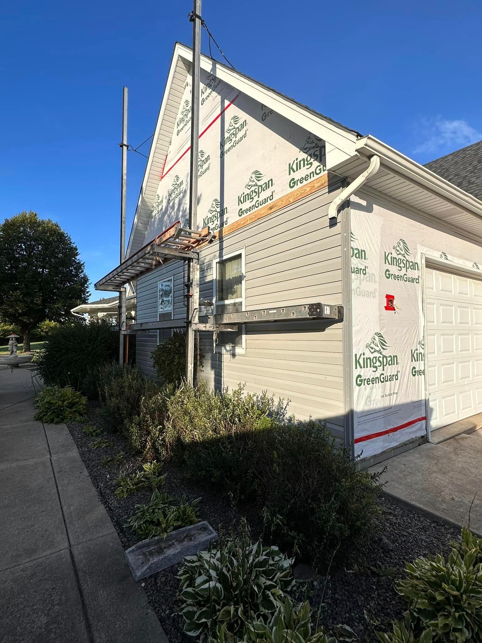 A house is being remodeled on the side of the road.