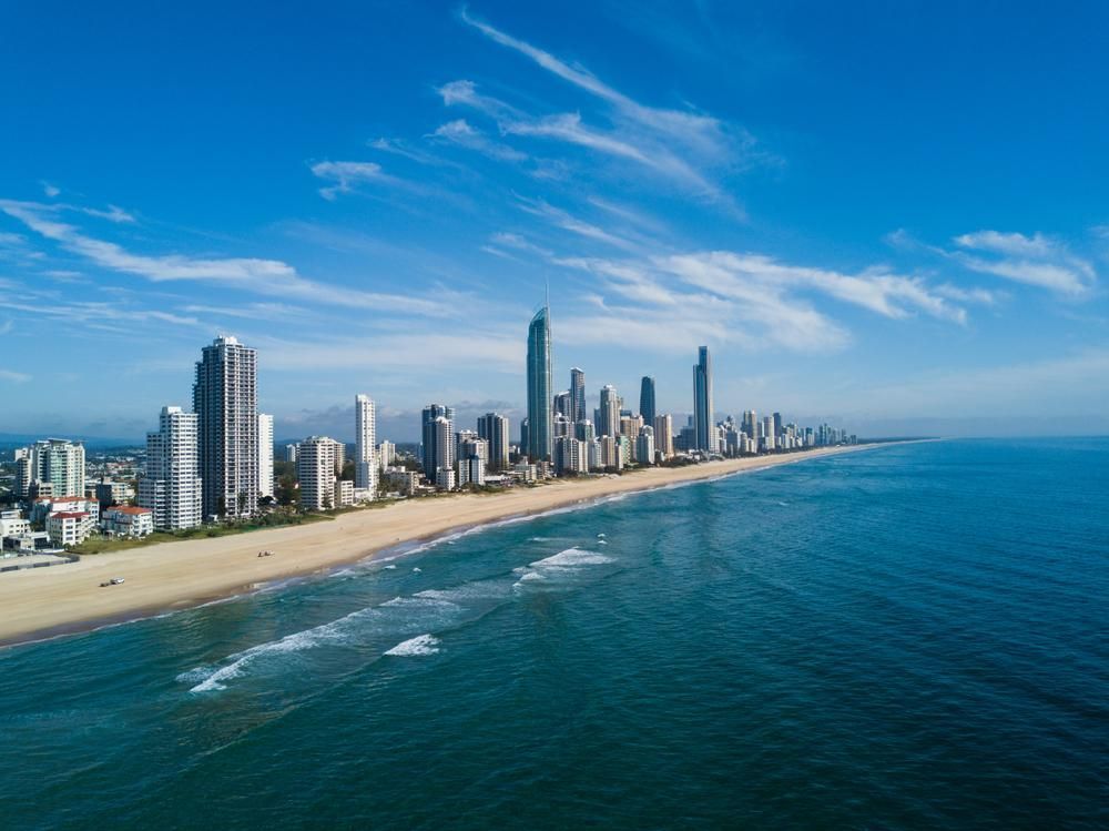 An Aerial View of a City Skyline Overlooking the Ocean — D’Art Interiors in Gold Coast, QLD