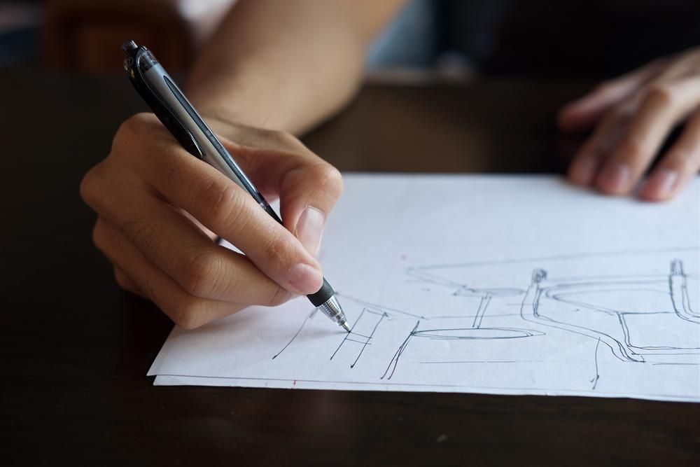 A Person is Drawing on a Piece of Paper — D’Art Interiors in Eureka, NSW