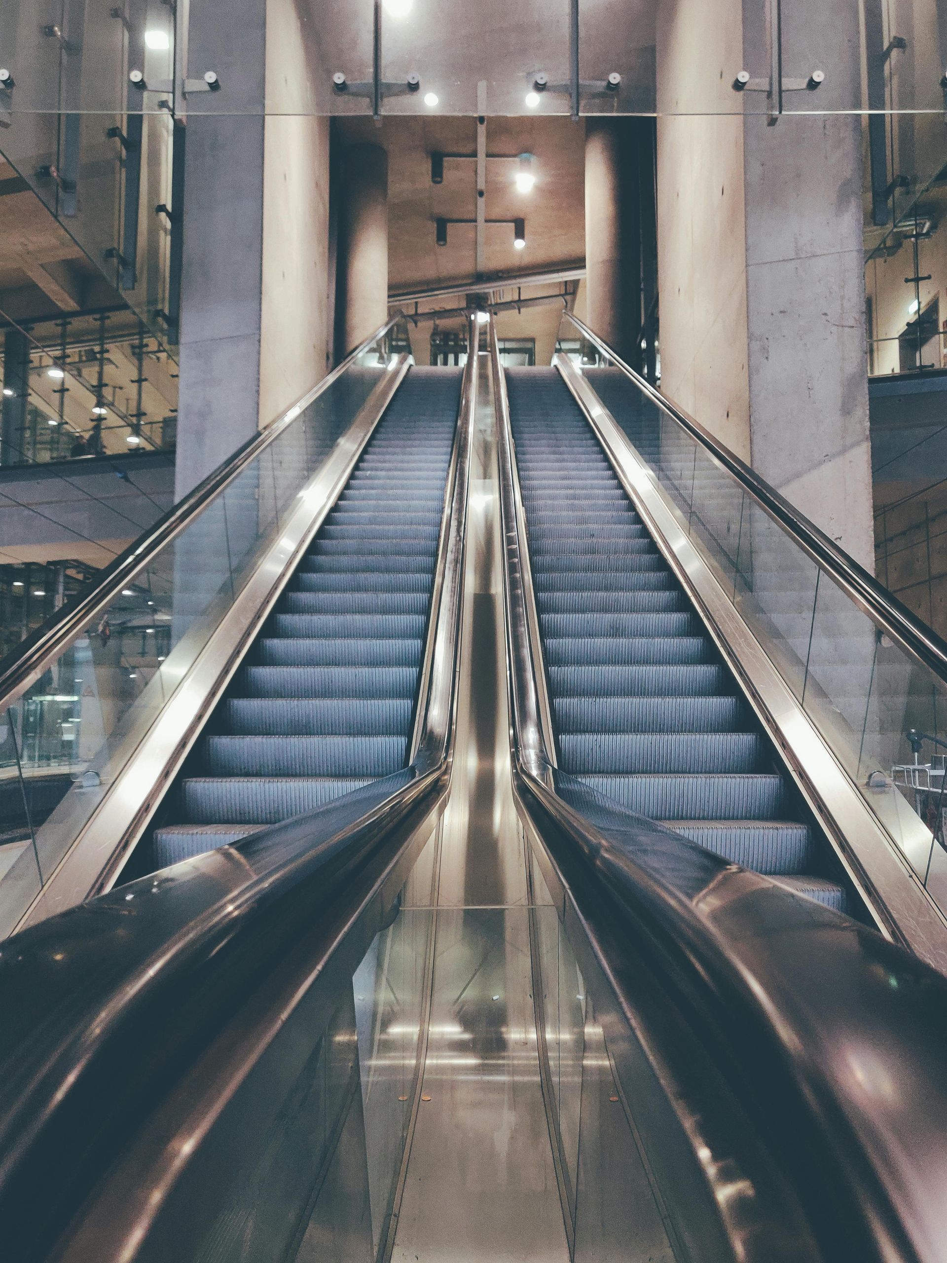 An escalator going up and down in a building