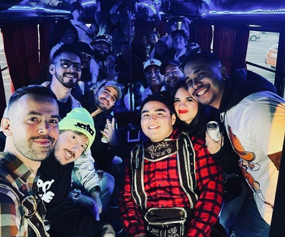 A group of people are posing for a picture on a party bus in Austin Tx