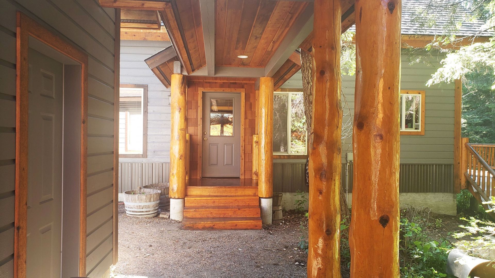 A house with a porch and stairs leading to it