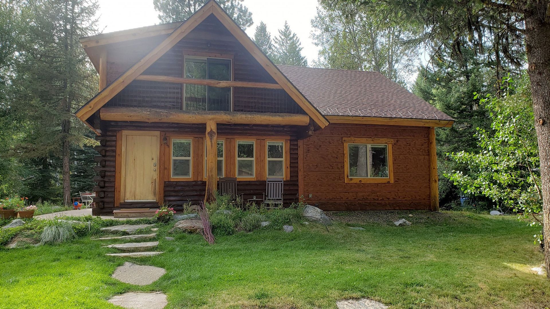 A house is sitting on top of a rocky hill.