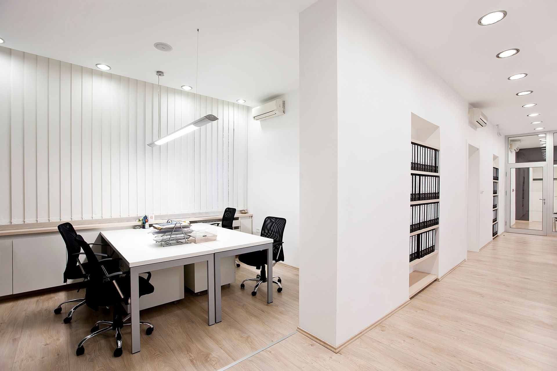 A room with a table and chairs in it