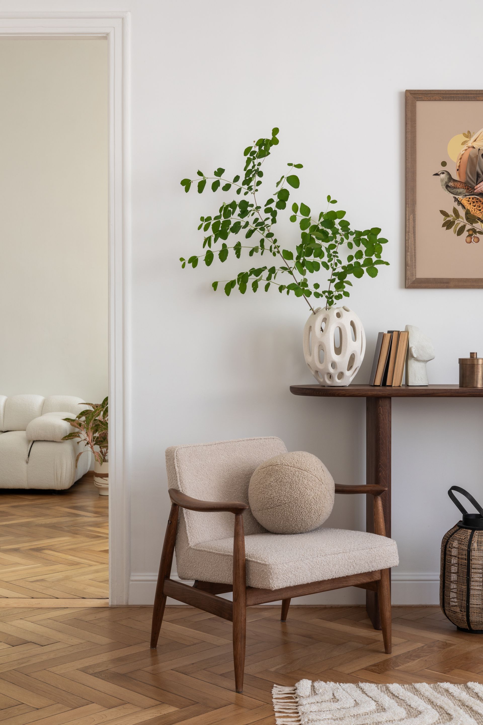 A chair is sitting in a living room next to a table.