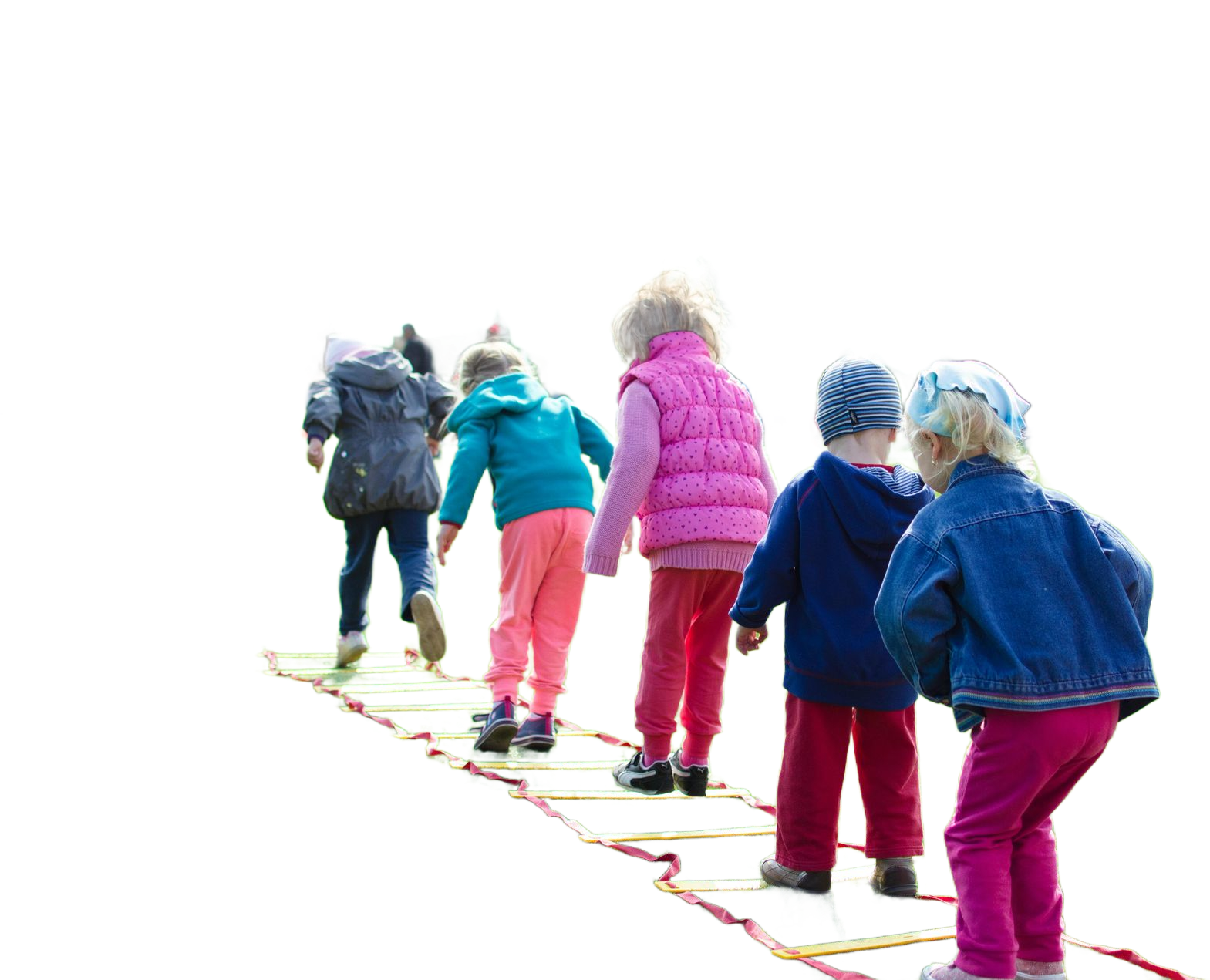 Children walking in a line on a red and yellow agility ladder.