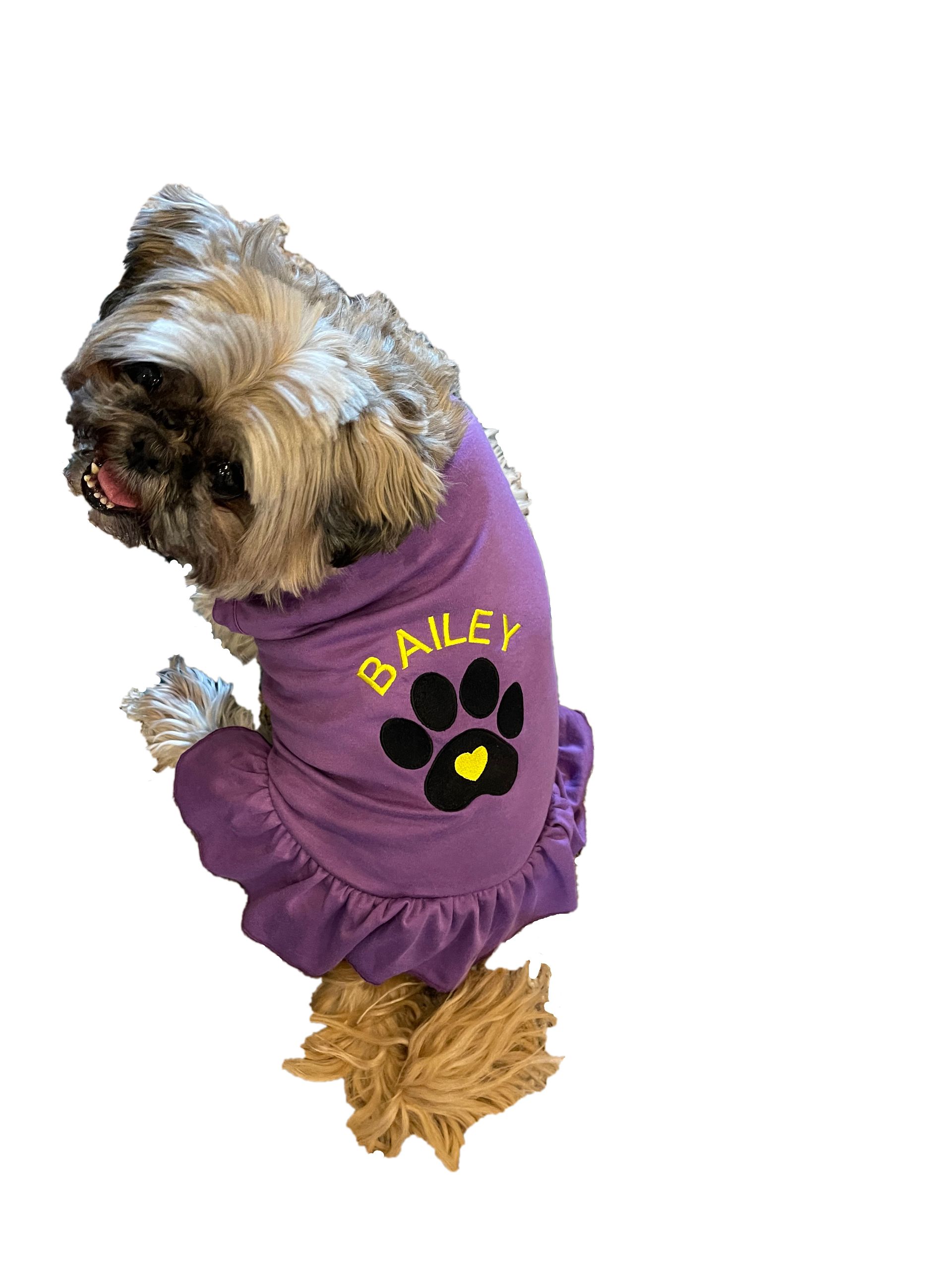 Pet Dress with ruffle. Includes embroidered name and cute paw print design.