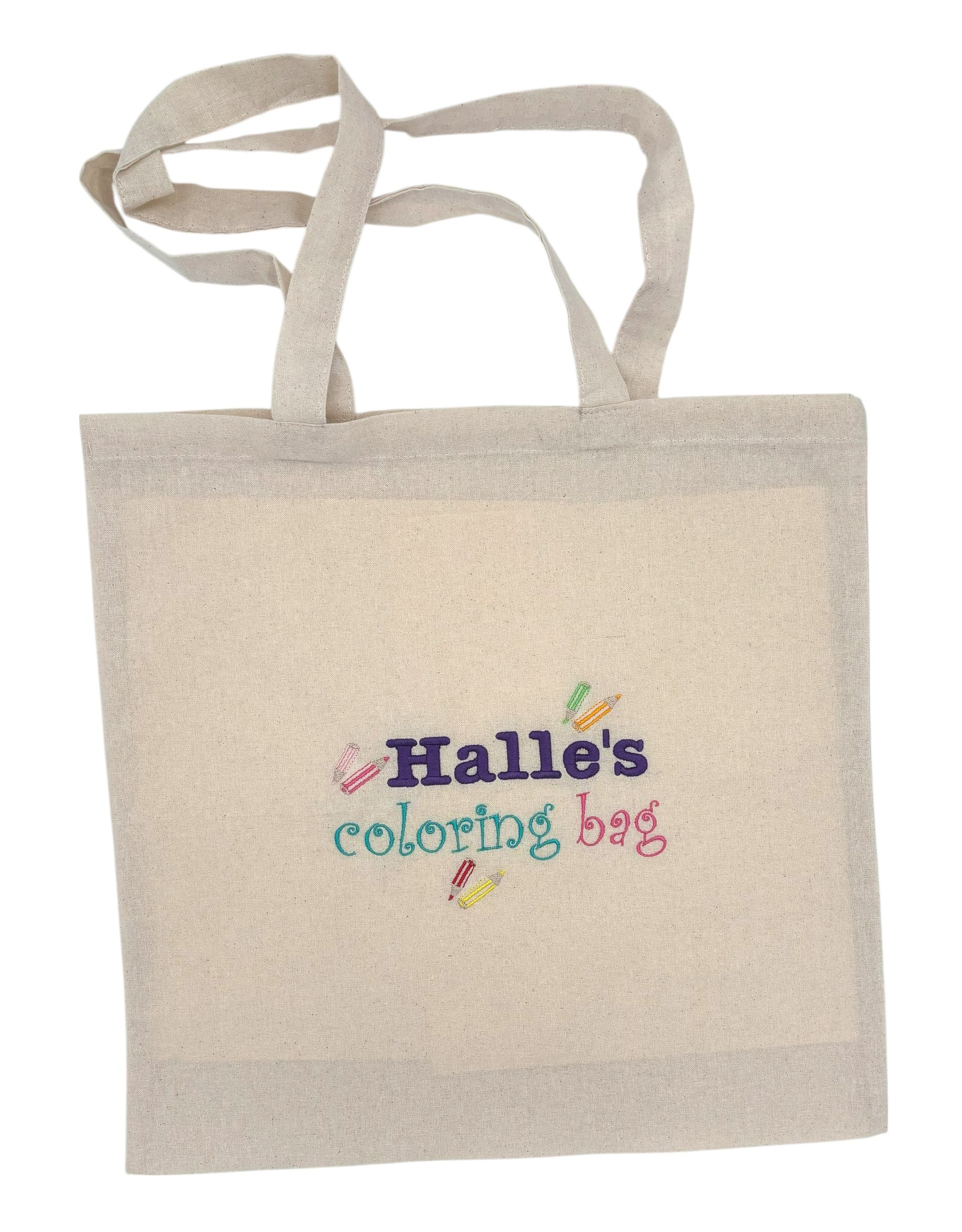 Canvas tote bag for carrying coloring books and crayons with child's name and crayons embroidered on one side