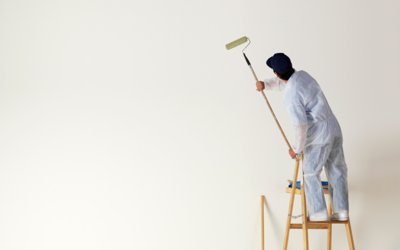 Man painting rental property