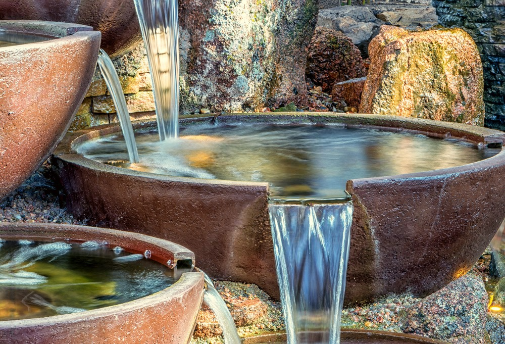 a waterfall is coming out of a bowl\ .