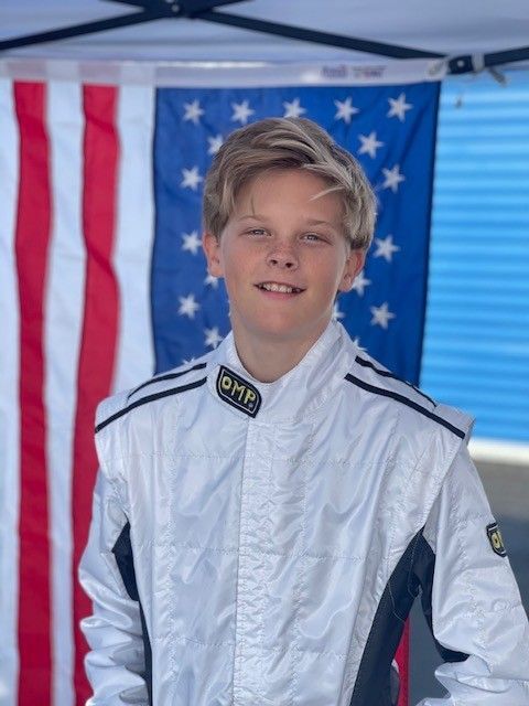 Boy wearing black cap and shirt with 