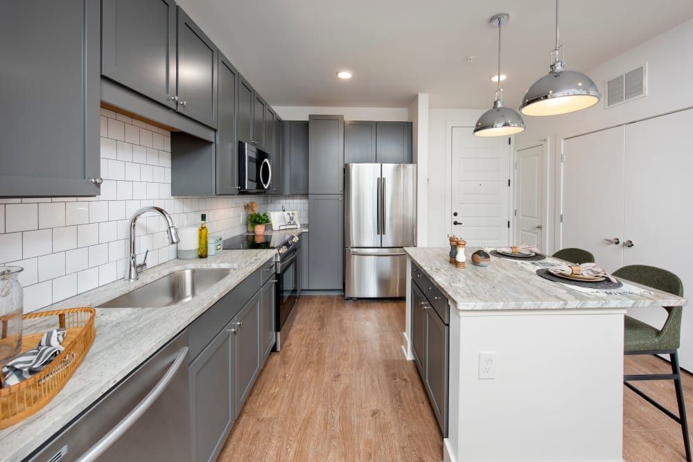 Modern Kitchen with Grey Cabinets and Large Island at The Brunswick