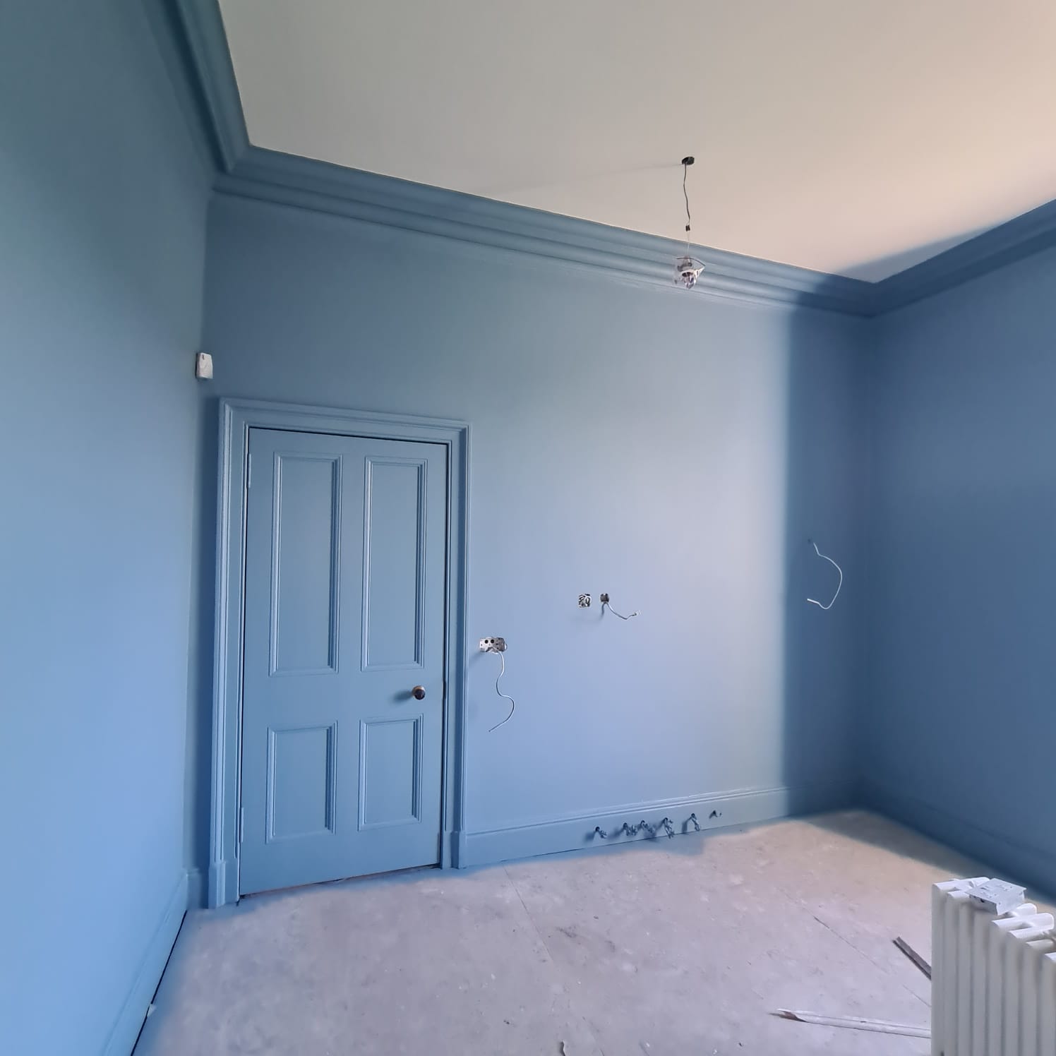 a room painted in pale blue by painters and decorators Edinburgh