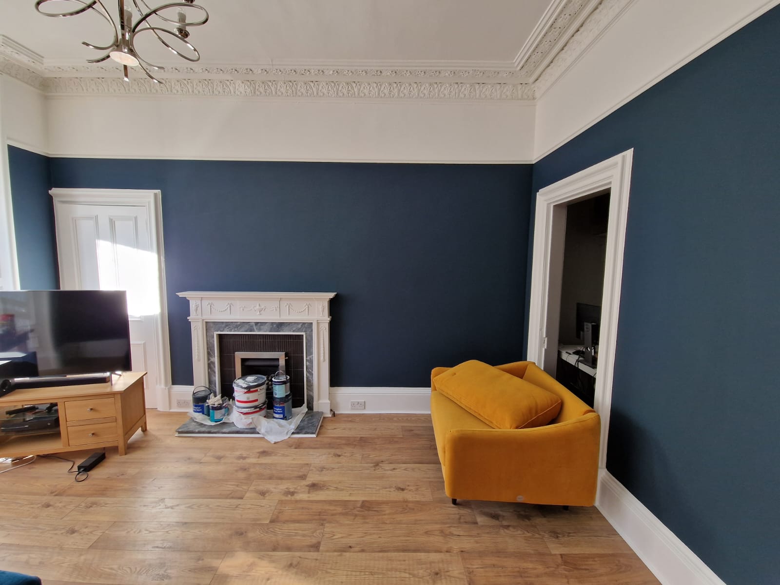 Living room painted blue and white with yellow furniture by Painters and Decorators Edinburgh