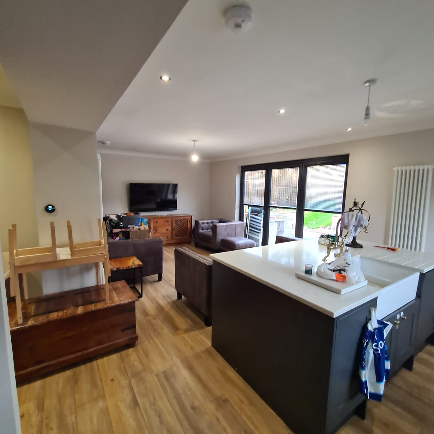 a kitchen with breakfast bar painted white by painters and decorators Edinburgh