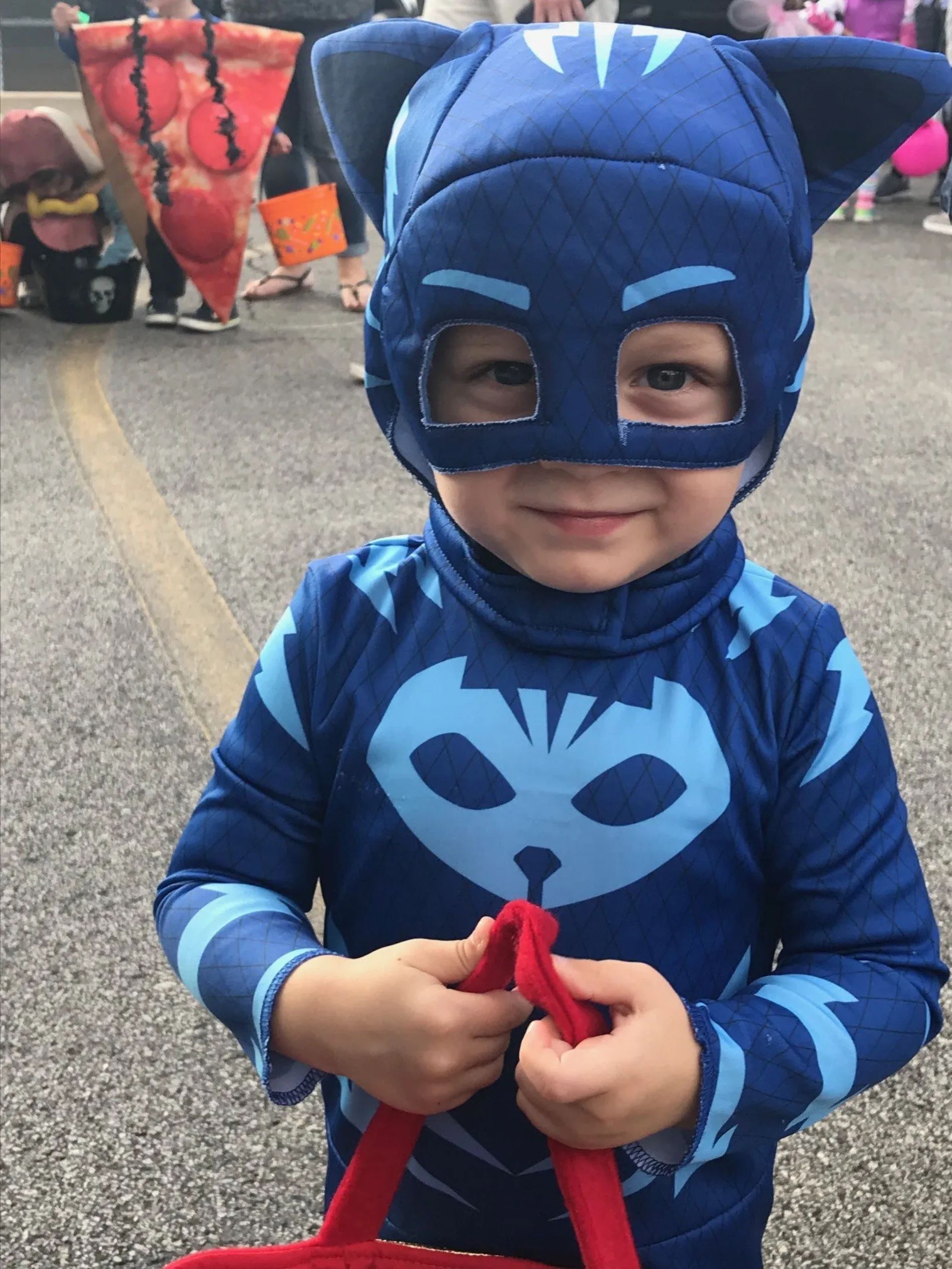 Child in a blue cat costume