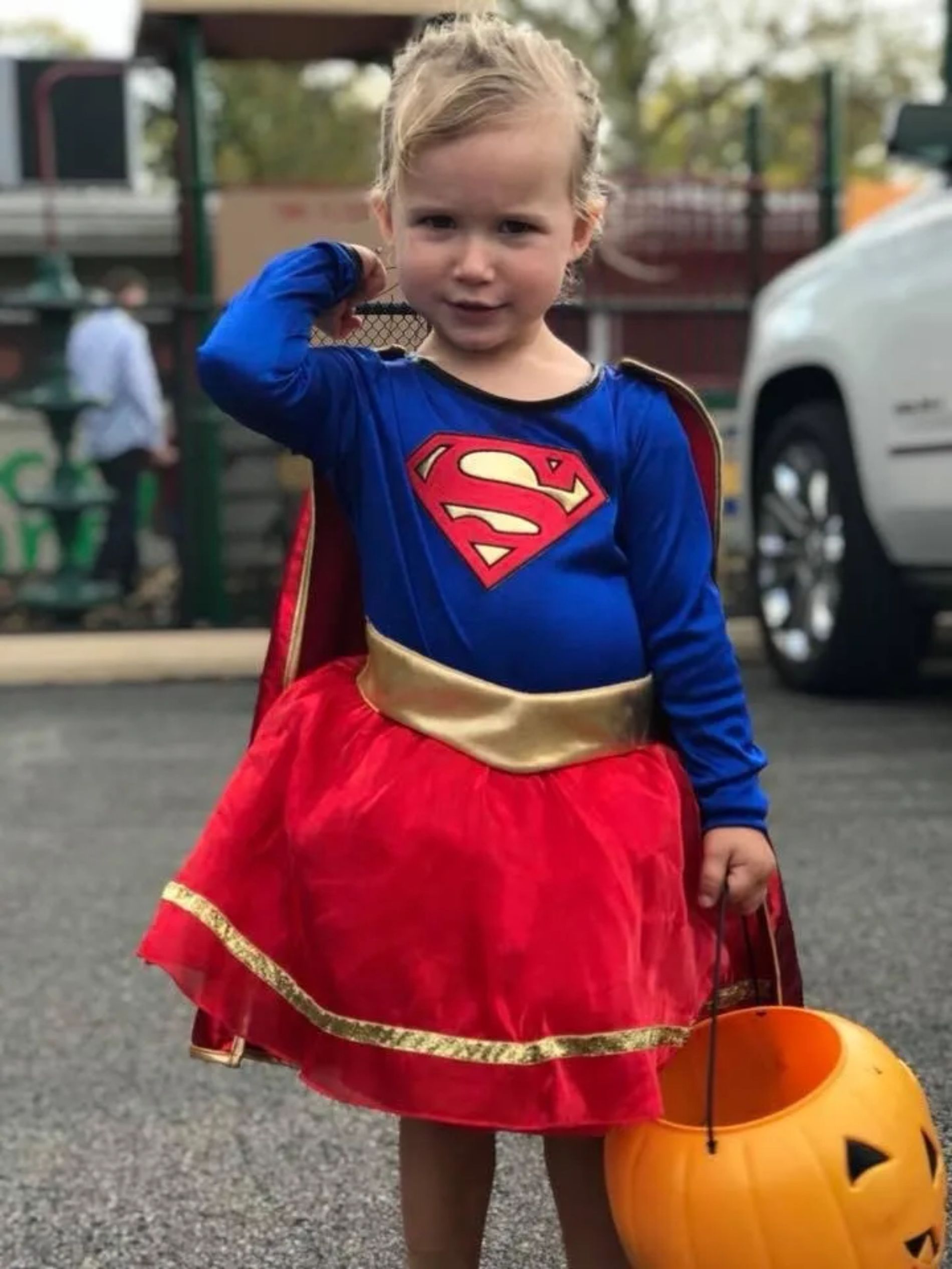 child dressed as supergirl at halloween