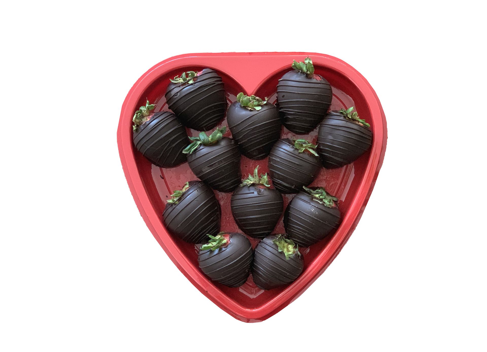 Chocolate-covered strawberries in a red heart-shaped plastic thermoformed container, arranged for presentation.