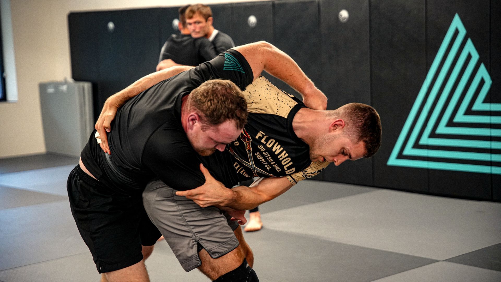 Students sparring at Lógica Brazilian Jiu-Jitsu in Chattanooga, TN, building calm confidence.