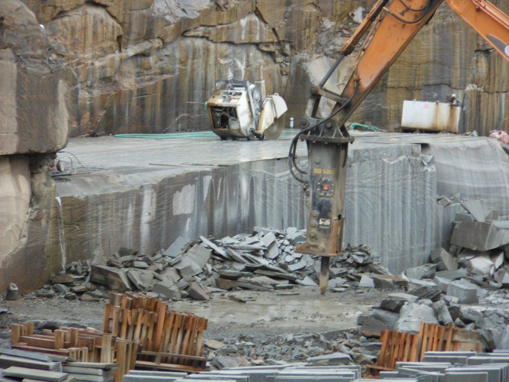 Bluestone Thermal saw cutting it  to be the right size needed for the client 