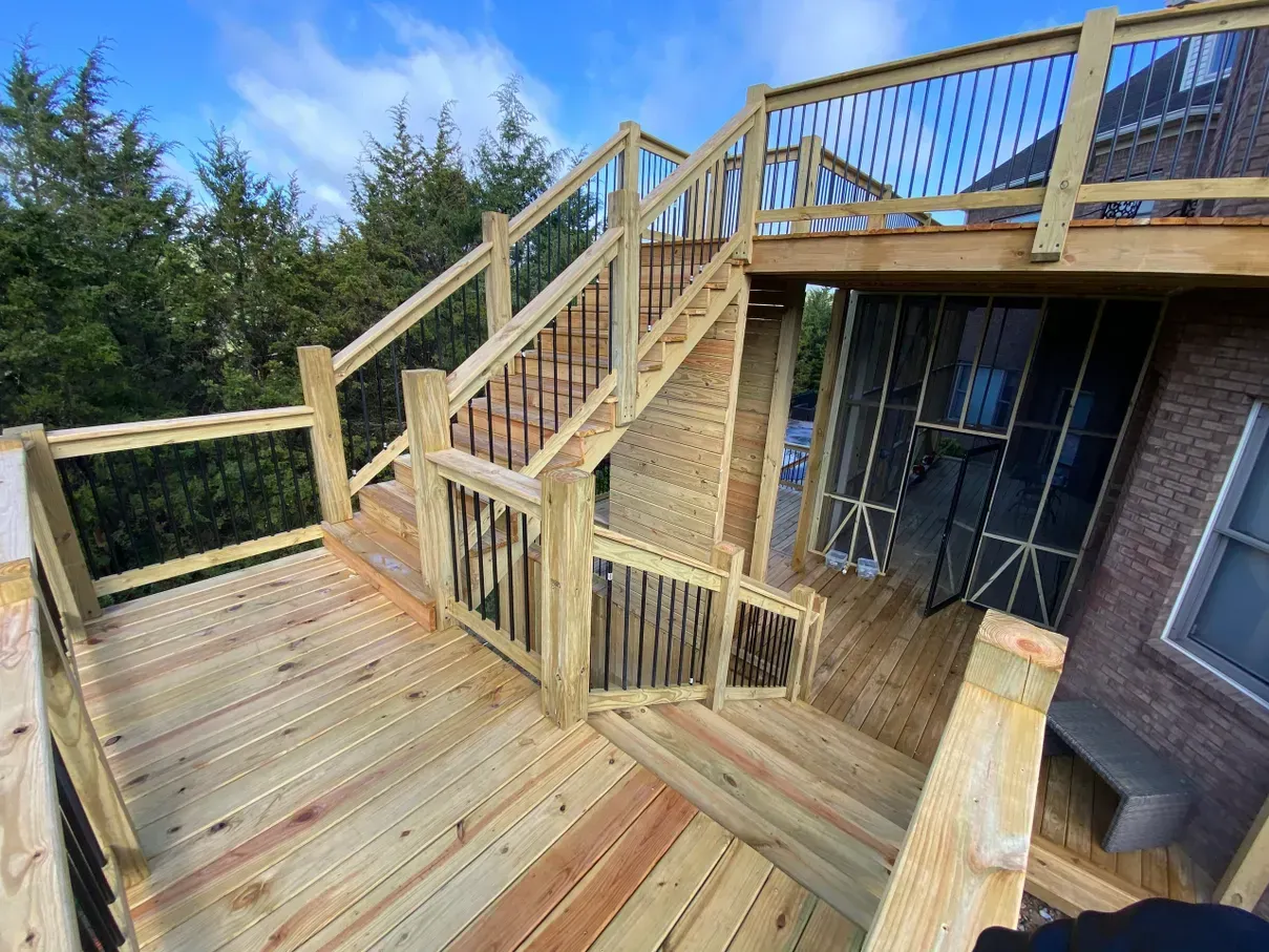 A wooden deck with stairs leading up to it.