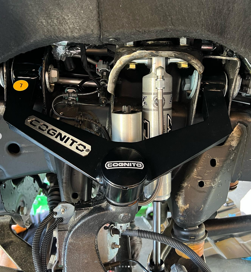 A close up of the underside of a car with cognito written on it