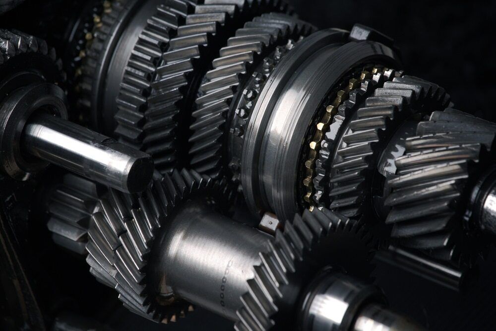 A Gearbox On A Black Background — Tonics Automotive in Garbutt, QLD