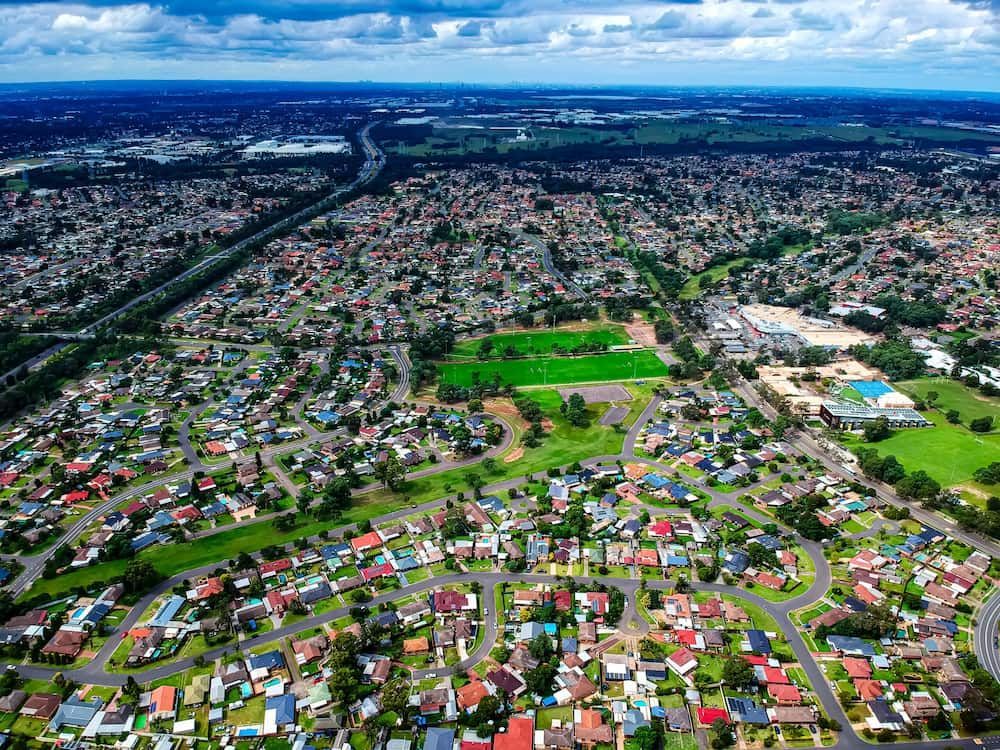 An Aerial View Of A Residential Area With Lots Of Houses And Trees — Tonics Automotive in Annandale, QLD