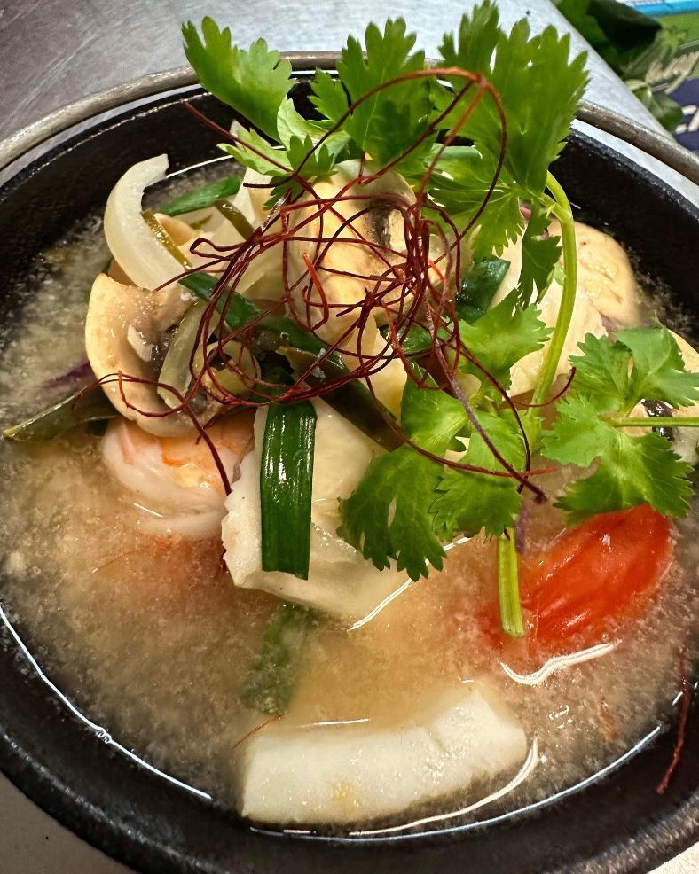 A Close Up of a Bowl of Soup With Vegetables on Top — Sway Thai Fusion & Bar In Tweed Heads South, NSW