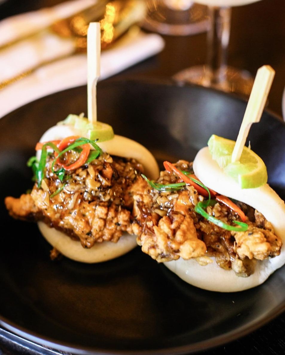 Two Sandwiches on a Black Plate With Toothpicks in Them — Sway Thai Fusion & Bar In Tweed Heads South, NSW