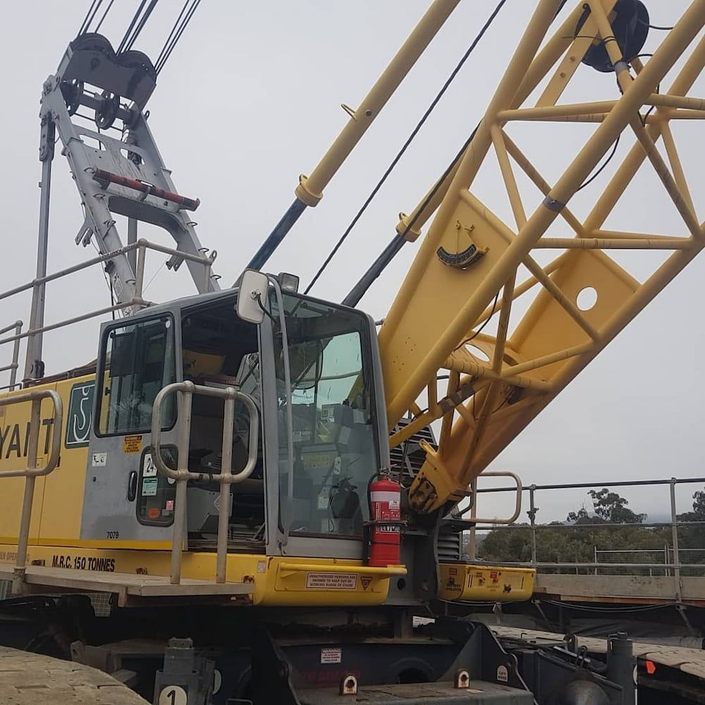 A Large Yellow Crane With the Word Yant on the Side — MJR Auto Glass In Crookwell, NSW
