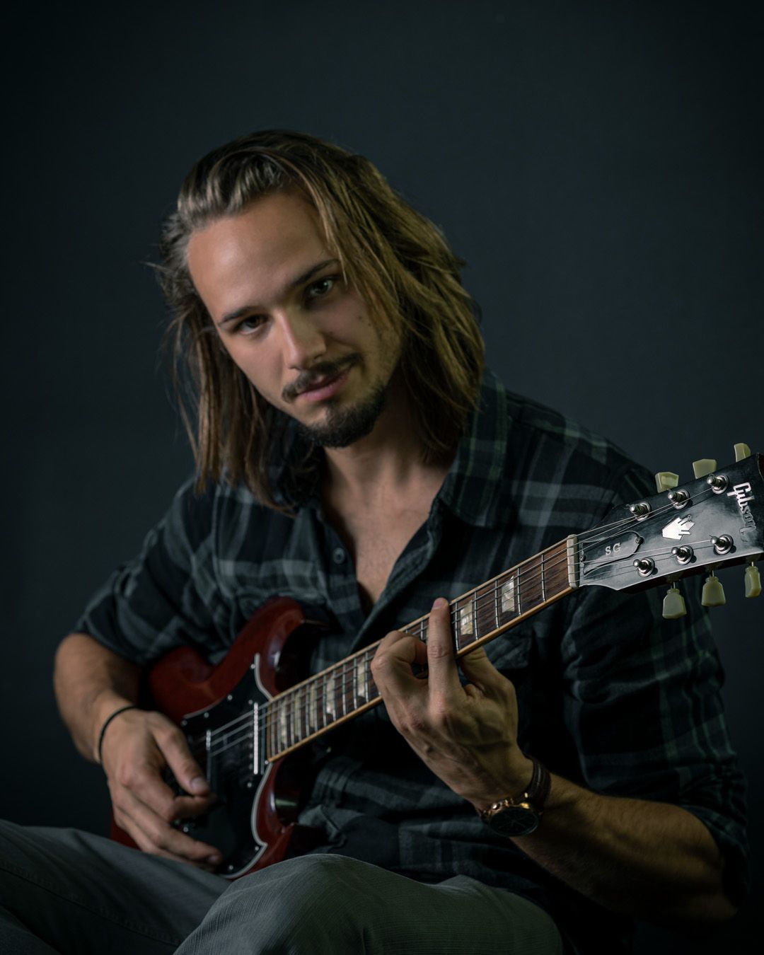 Justin Craddock playing guitar in Winnipeg