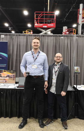 Justin Craddock and Fabio Hofnik posing at the 2023 CSAM conference representing Bit Space Development