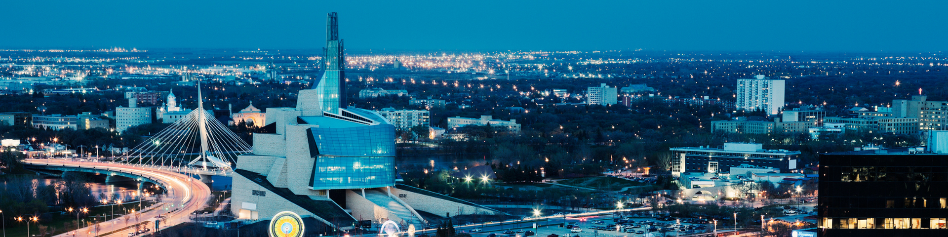 An aerial view of Winnipeg at night with a lot of lights.