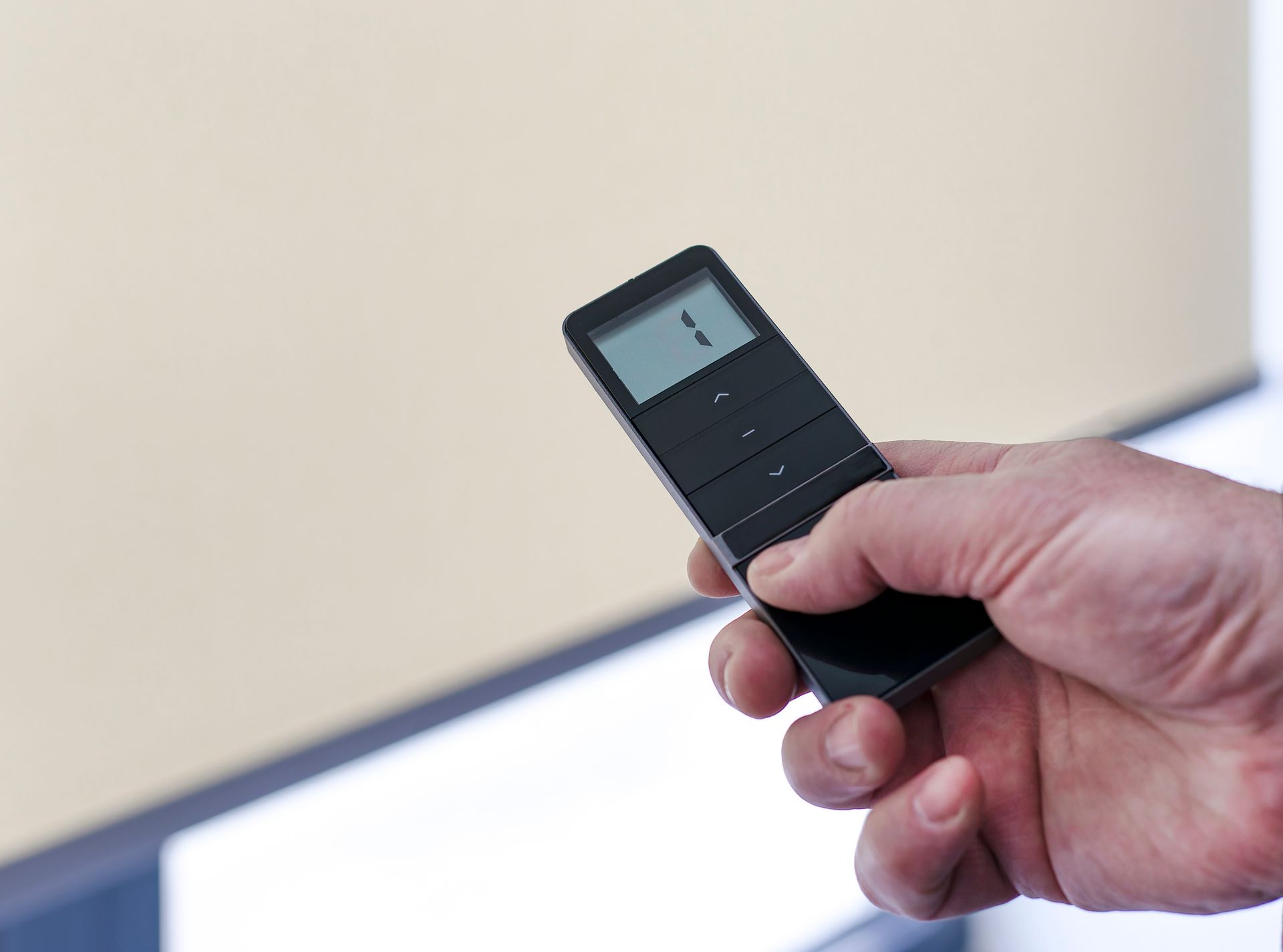 Remote control adjusting motorized blinds for home or office window coverage.