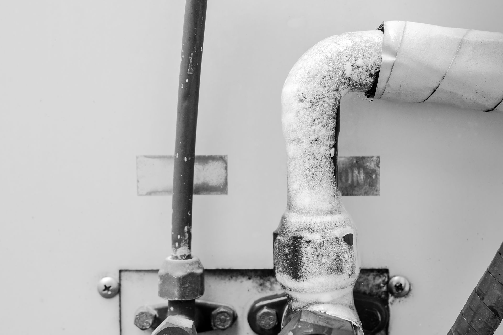 Brown water stain on a white ceiling, with a small hole visible below.