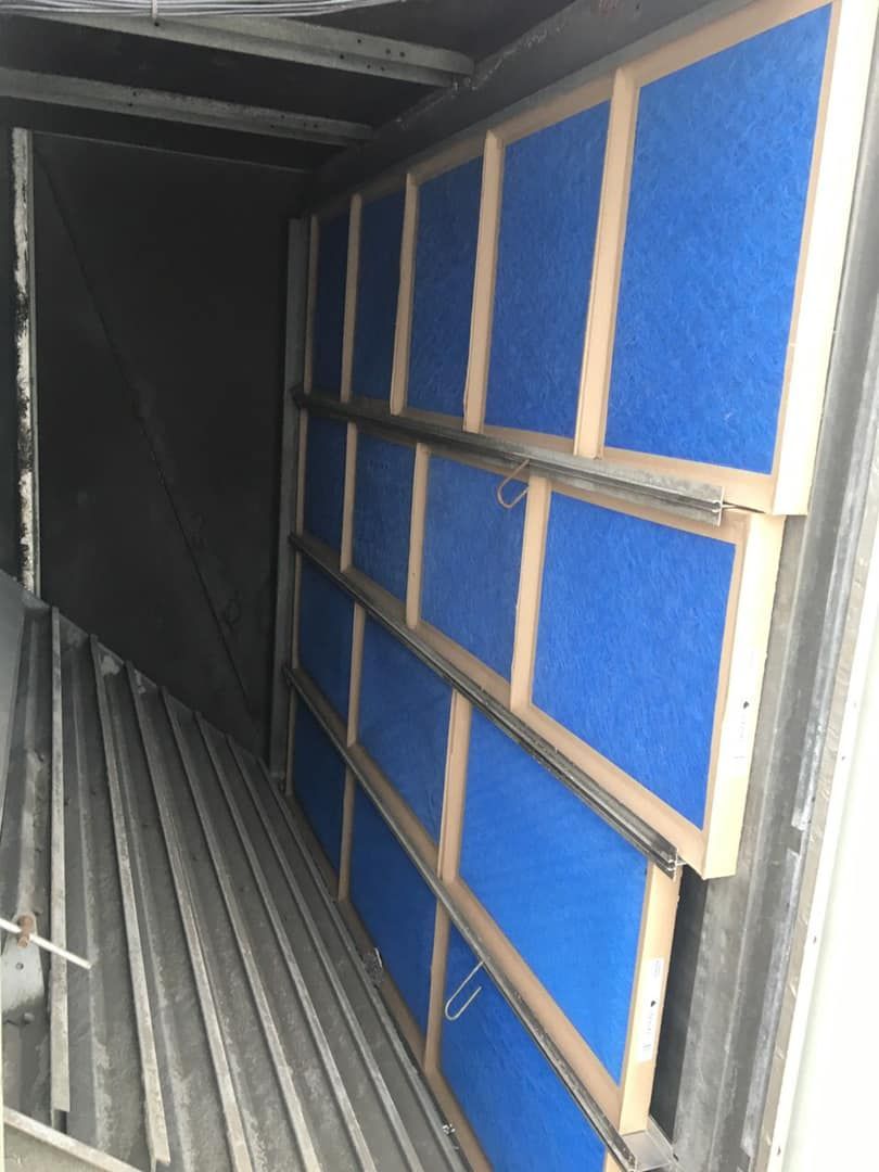 The inside of a building with blue squares on the wall