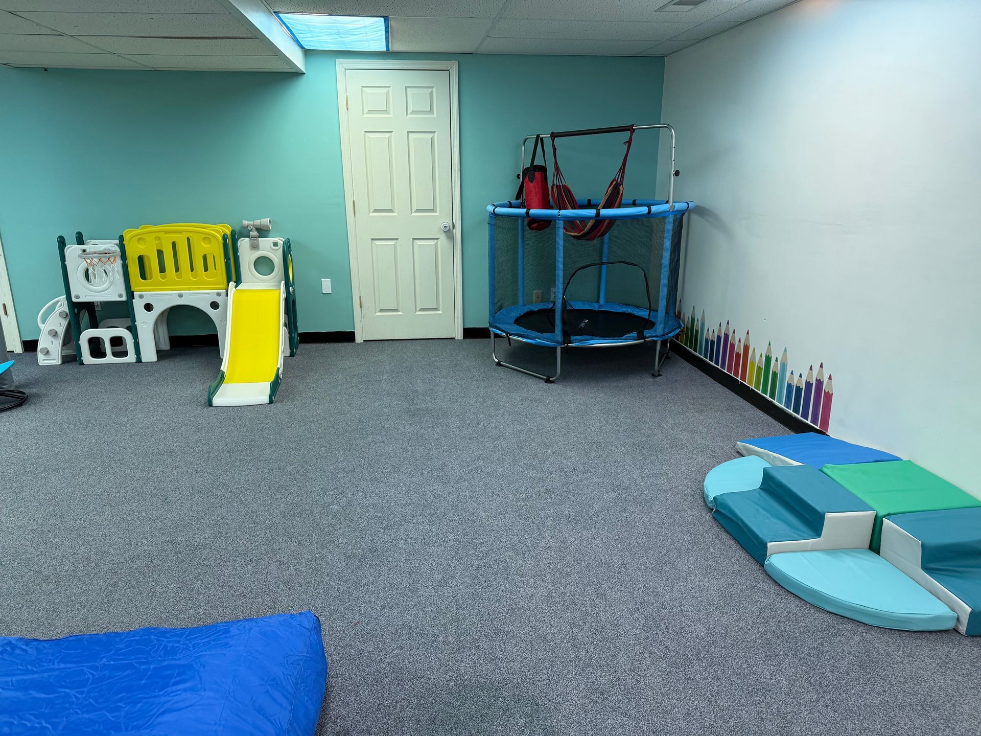 A Woman is Sitting at a Table Talking to a Little Boy