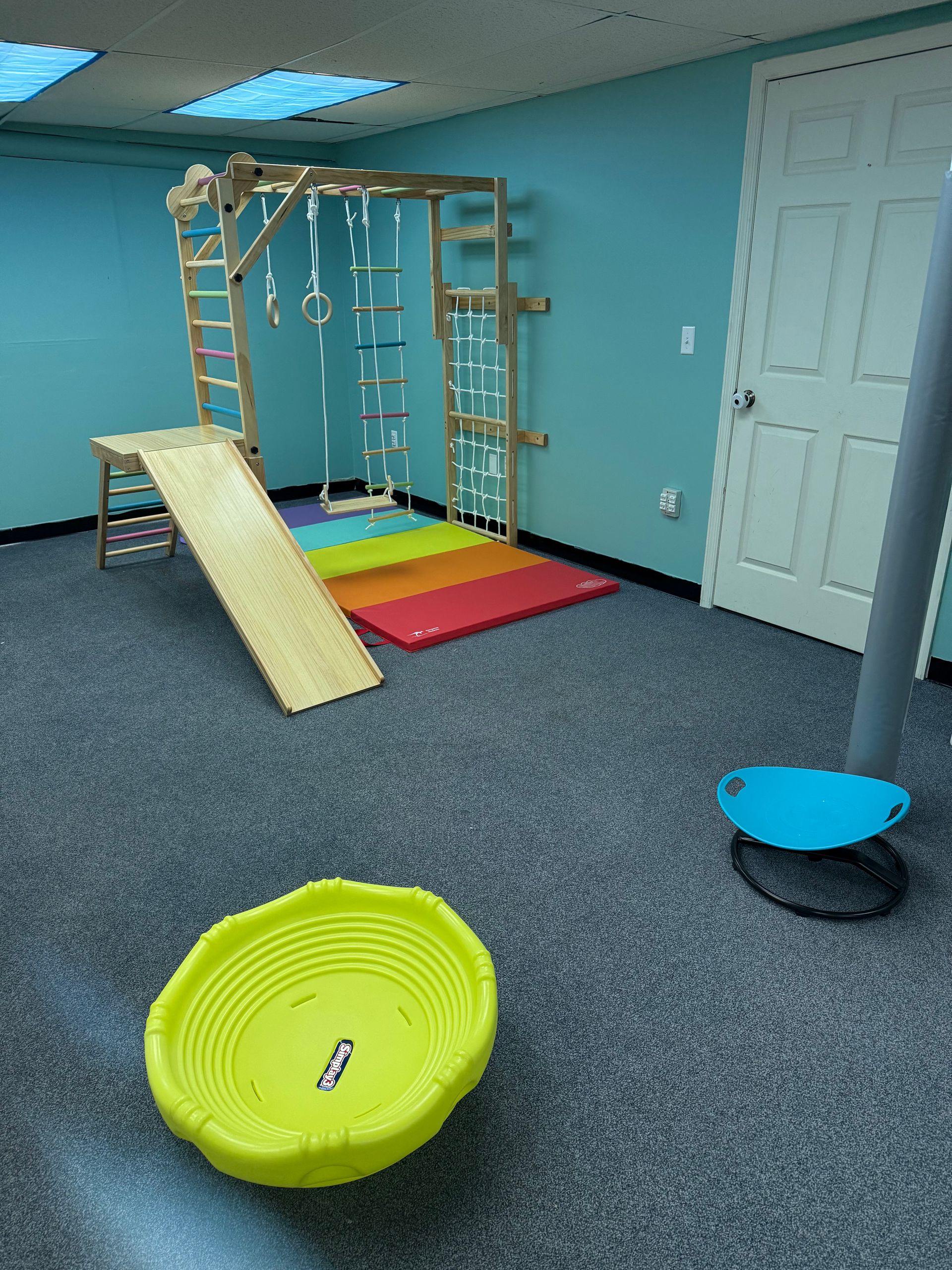 A Woman and a Boy Are Sitting on a Couch Holding a Piece of Paper With a Brain on It