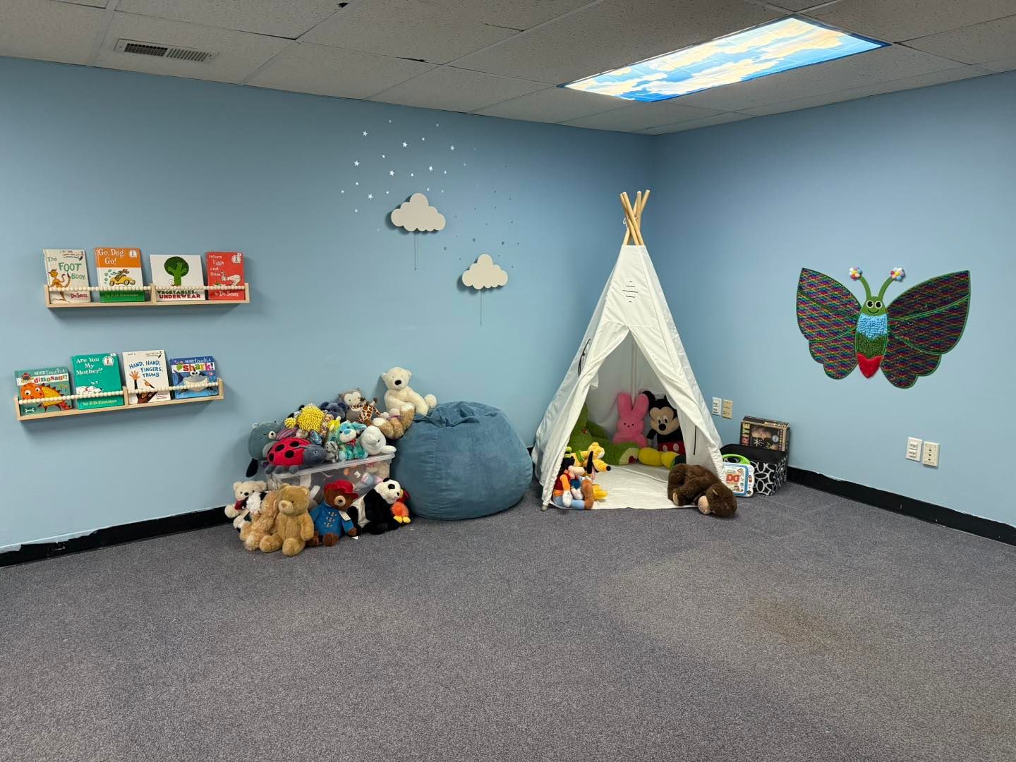 Hands holding colorful puzzle pieces. Green grass background.