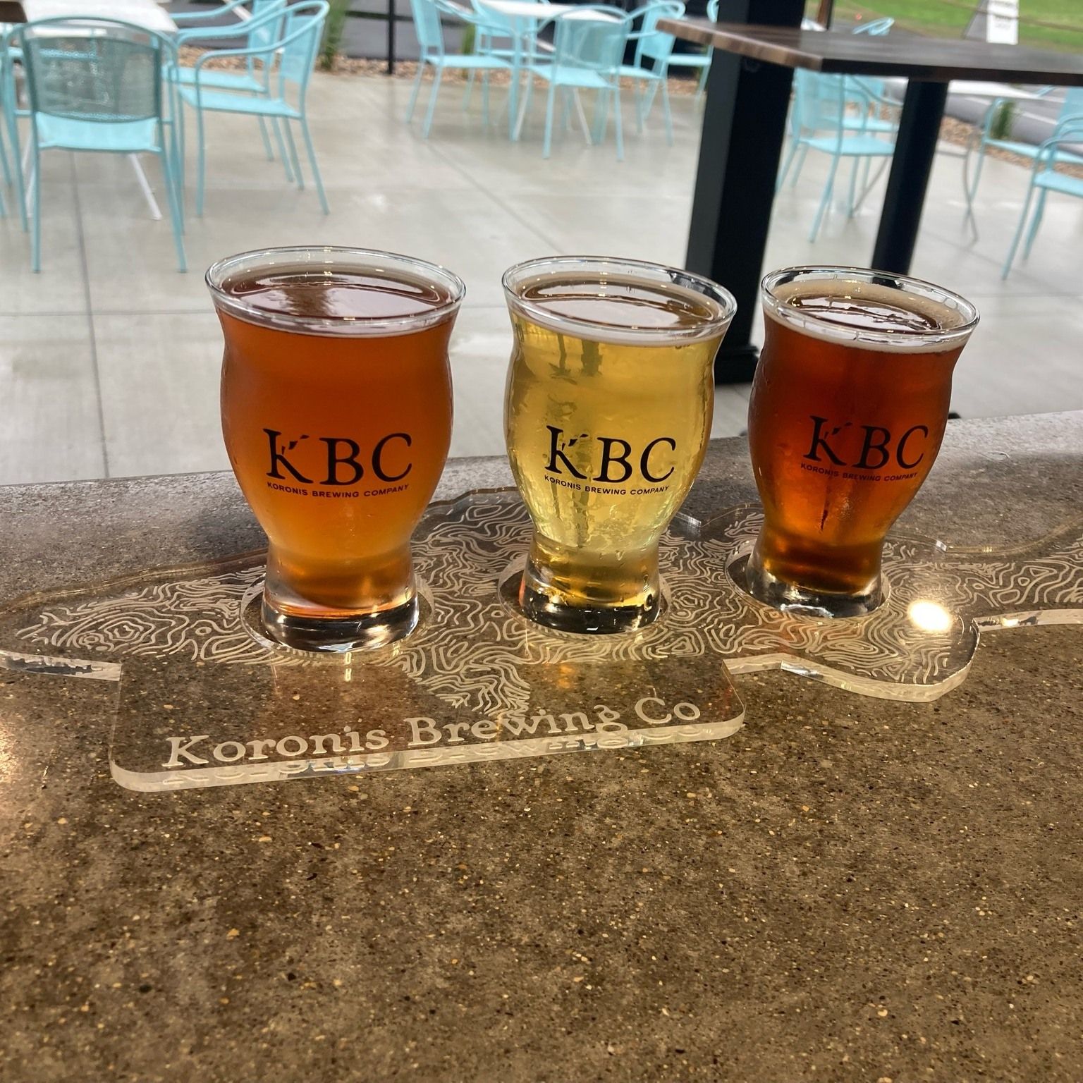Two people are toasting with two glasses of beer.