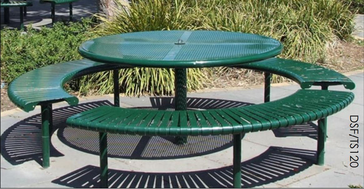 A green metal picnic table with a round top