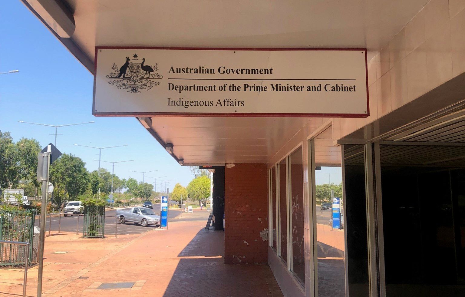 A sign on the side of a building that says department of the police