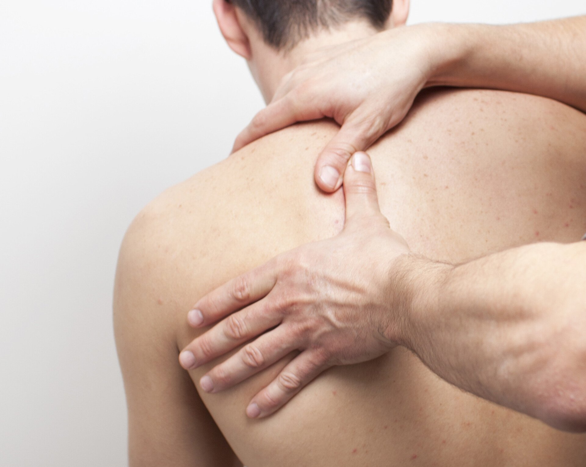 woman's neck being massaged