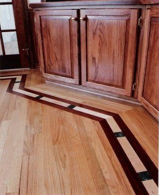 A wooden floor with a geometric design on it