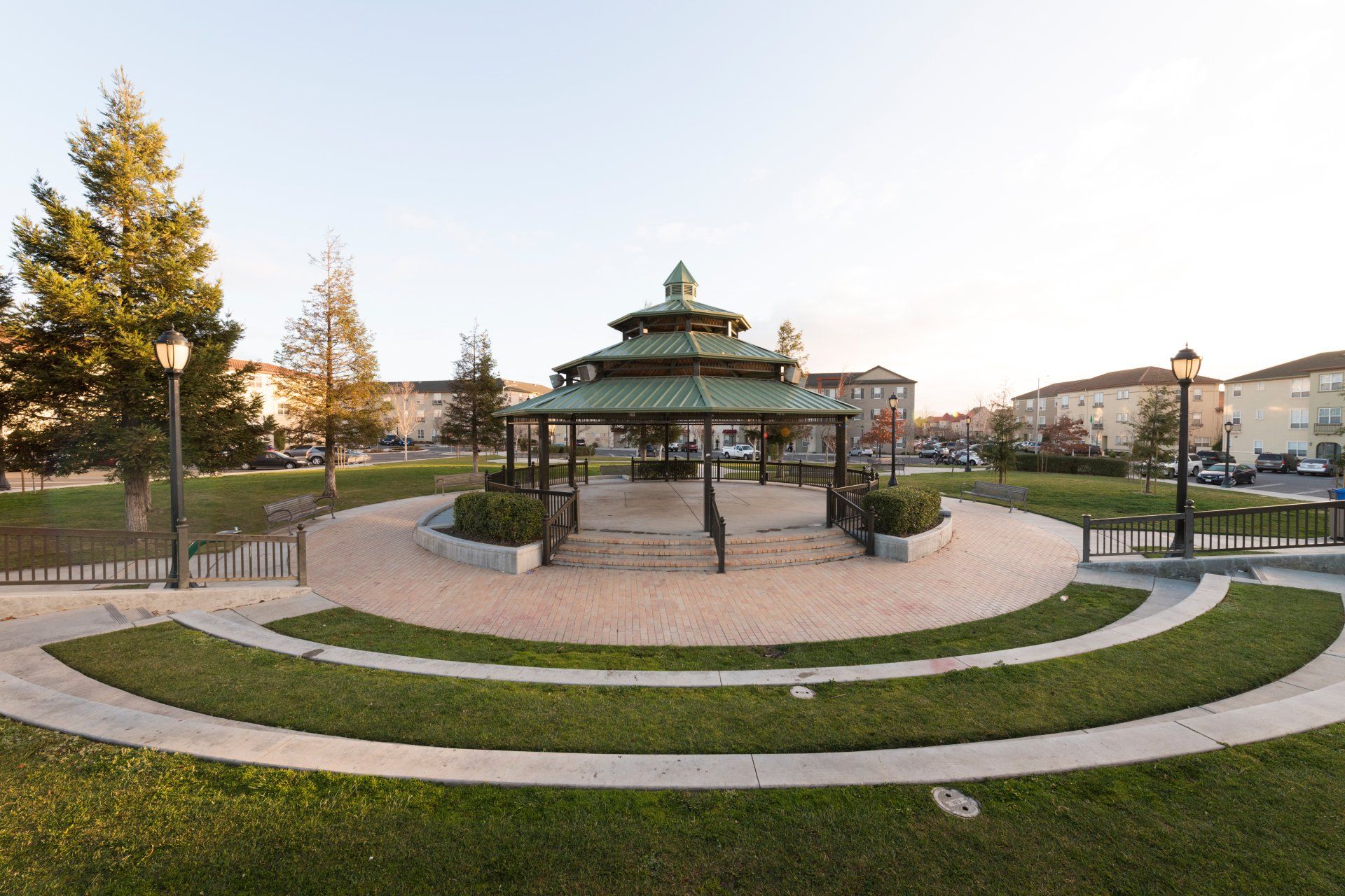 A gazebo is in the middle of a park