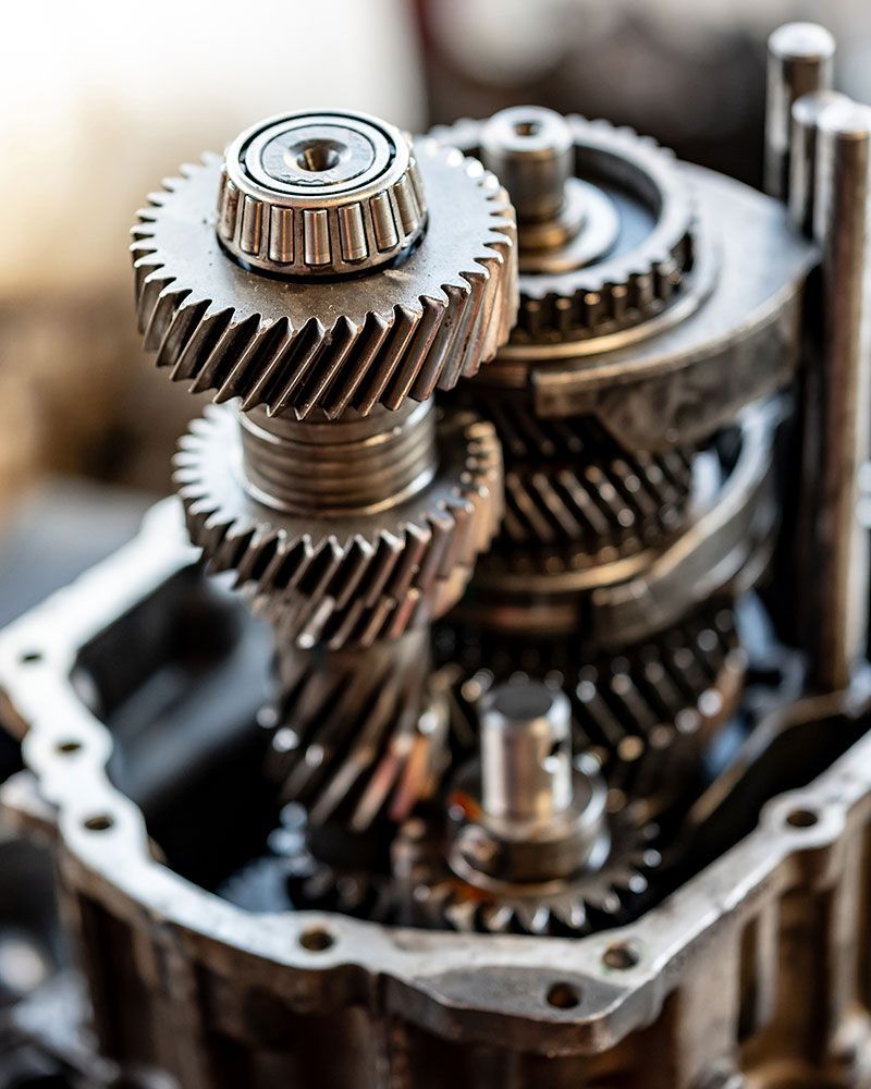 A close up of a gearbox with gears stacked on top of each other.