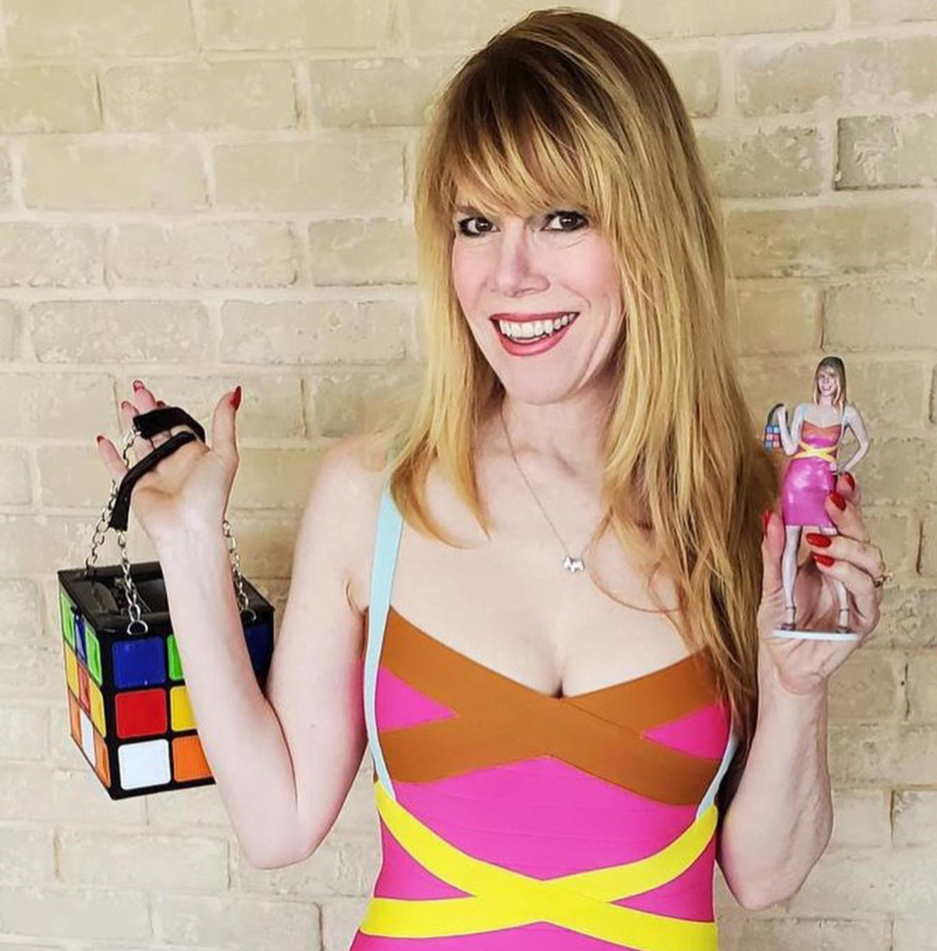 lady holding mini statue of herself 