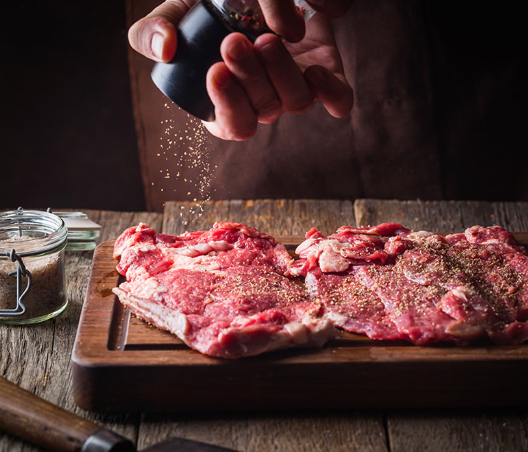 pepper shakes on steak
